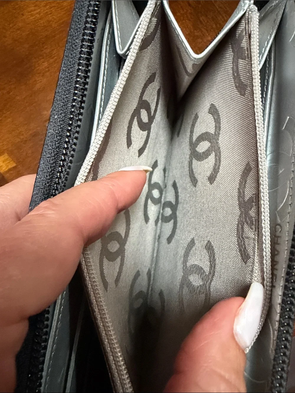 CHANEL Black Quilted Zip Wallet with Silver CC Patch
